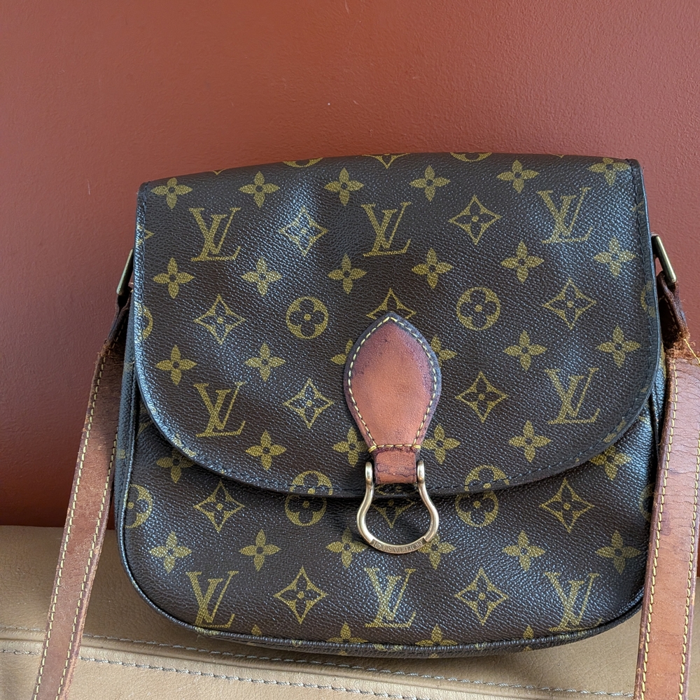 Louis Vuitton Brown Monogram Crossbody Bag. The strap is almost teared apart.